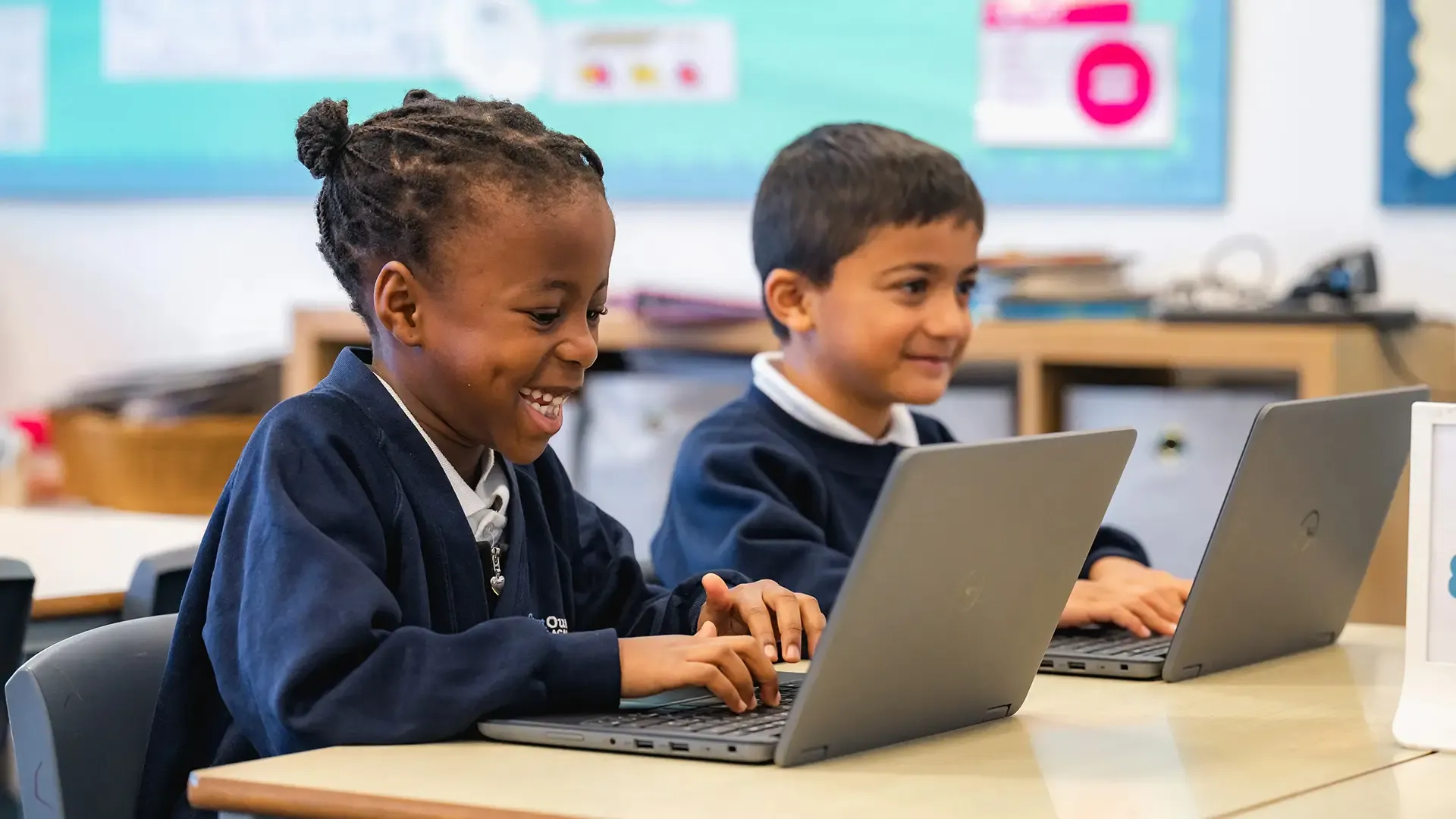 Children working on laptops